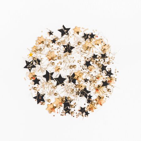 Christmas composition. Christmas pattern made of golden and black decorations on white background. Flat lay, top view, squareの写真素材