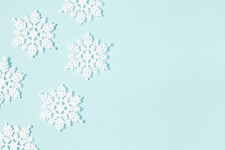 Christmas or winter composition. Pattern made of snowflakes on pastel blue background. Christmas, winter, new year concept. Flat lay, top view, copy spaceの写真素材