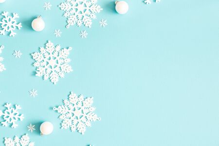 Christmas or winter composition. Pattern made of snowflakes on pastel blue background. Christmas, winter, new year concept. Flat lay, top view, copy spaceの写真素材