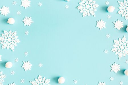 Christmas or winter composition. Pattern made of snowflakes on pastel blue background. Christmas, winter, new year concept. Flat lay, top view, copy spaceの写真素材