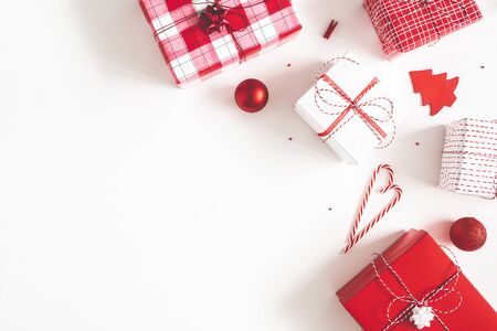 Christmas composition. Gift box, christmas decorations on white background. Flat lay, top view, copy spaceの写真素材