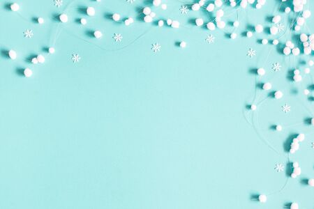 Christmas or winter composition. Pattern made of snowflakes and snowballs on pastel blue background. Christmas, winter, new year concept. Flat lay, top view, copy spaceの写真素材