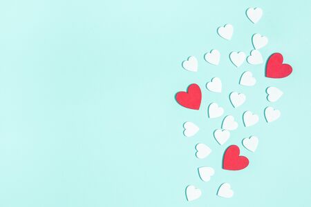 Valentine's Day background. White and red hearts on pastel blue background. Valentines day concept. Flat lay, top view, copy spaceの写真素材