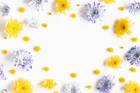 Flowers composition. Frame made of chrysanthemum flowers on white background. Flat lay, top viewの写真素材