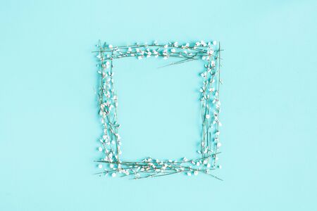 Flowers composition. White flowers on blue background. Spring concept. Flat lay, top view, copy spaceの写真素材