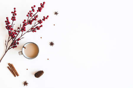 Autumn composition. Cup of coffee, berries on white background. Christmas, winter concept. Flat lay, top viewの写真素材