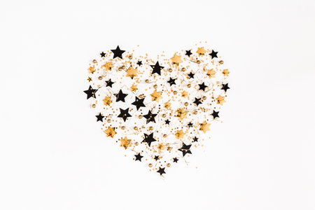 Christmas composition. Christmas golden and black decorations on white background. Flat lay, top viewの写真素材