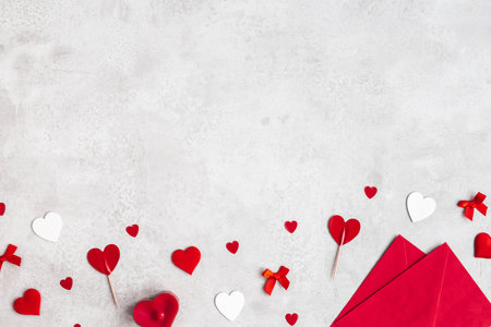 Valentine's Day background. Envelope, hearts on concrete gray background. Valentines day concept. Flat lay, top viewの写真素材
