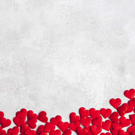 Valentine's Day background. Red hearts on concrete gray background. Valentines day concept. Flat lay, top view, copy spaceの写真素材