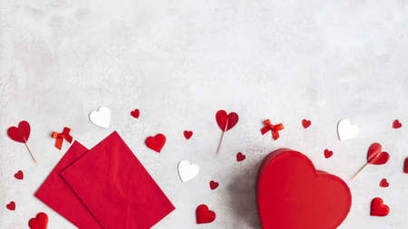 Valentine's Day background. Gift, envelope, hearts on concrete gray background. Valentines day concept. Flat lay, top viewの写真素材