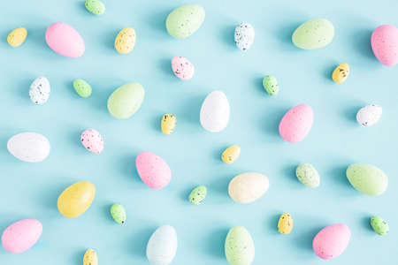 Easter eggs on blue background. Easter concept. Flat lay, top viewの写真素材