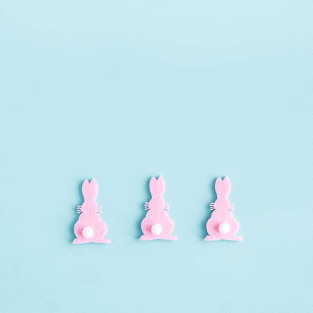Easter composition. Rabbits on pastel blue background. Easter minimal concept. Flat lay, top viewの写真素材