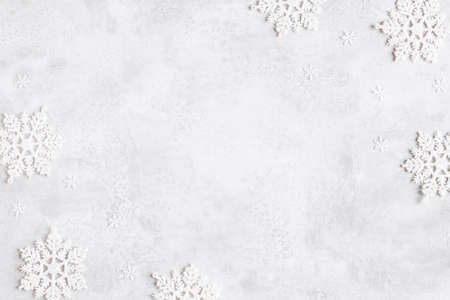 Christmas composition. Frame made of snowflakes on gray background. Christmas, winter, new year...