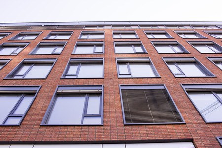 Brick building, view from the bottomの写真素材