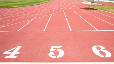 Red treadmill at the stadium with the numbering from fourth five six