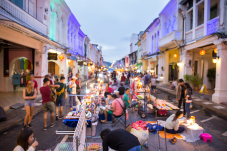 Blur of Tourists shop at walking street night market of Phuket Thailand among old building Chino Portuguese styleのeditorial素材