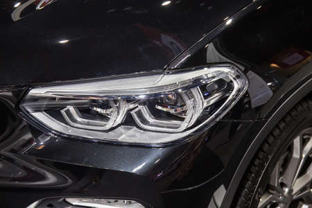 Close up of detail on one of the LED headlights modern and luxury car. Select focus.