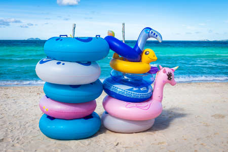 The rubber rings stacked in layers on the beach with blue sky background on Koh Larn, Pattaya, Thailand.の写真素材