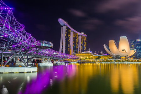 Singapore - November 20 2016: Modern architecture Singapore skyline at dusk with reflection and light color show in night time. Singapore is an island city-state in Southeast Asia.のeditorial素材