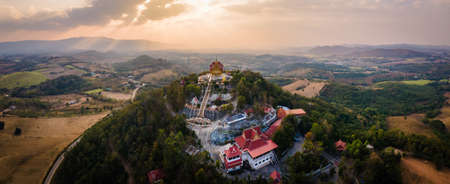 Panorama landscape of Wat Pa Phu Hai Long on the mountain at sunset and twilight at Pak Chong, Nakhon Ratchasima, Thailand.の写真素材