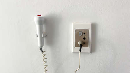 Pressed to call the nurse stuck on the wall of the room.