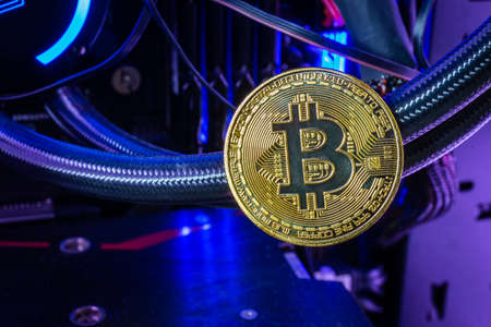 Close up of Golden bitcoin in computer. Crypto Currency concept and online trading of blockchain...