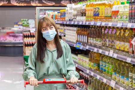 Women wear masks to shop in supermarketsの写真素材