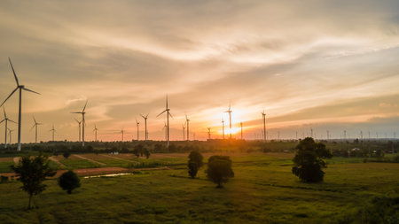 Landscape panorama of Many wind turbine at the fields at sunsetの写真素材