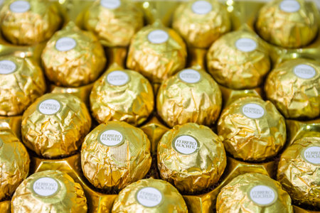 BANGKOK, THAILAND- FEBRUARY 3, 2022: Ferrero Rocher Chocolates, arranged neatly, are popular items...