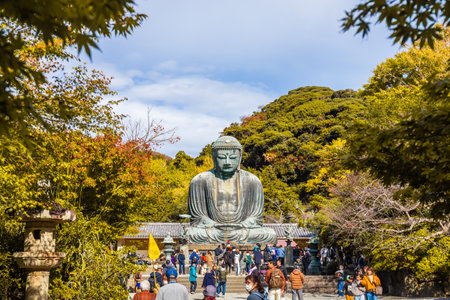 Kanagawa, Japan - November 13, 2023: People front of Daibutsu or Great Buddha of Kamakura in Kotokuin Temple It is an important landmark and a popular destination for tourists and pilgrims.のeditorial素材