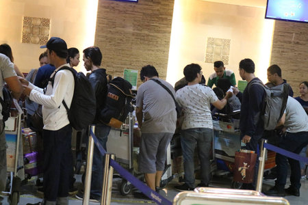Travellers queuing at the airportのeditorial素材