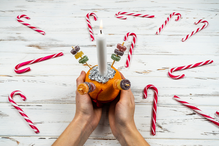 Orange Christingle is a symbolic object used in the Advent, Christmas and Epiphany services of many Christian denominationsの写真素材