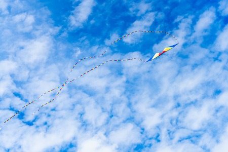 Kites flying in the sky among the clouds.Kite Festival.の写真素材