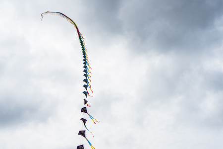 Kites flying in the sky among the clouds.Kite Festival.の写真素材