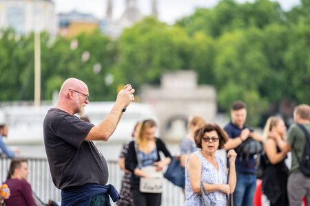 London, UK, July, 2019. Close up portrait of happy attractive people taking selfie in London
