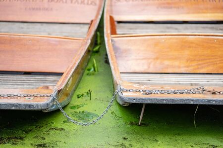 A punt is a flat-bottomed boat with a square-cut bow, designed for use in small rivers or other shallow water. Cambridge, Englandの写真素材