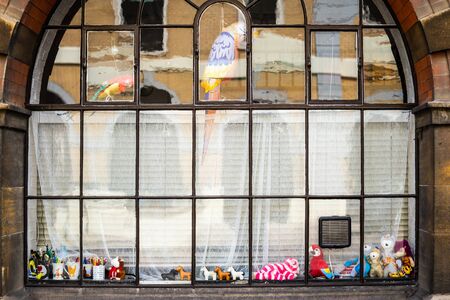 Cambridge, UK, August 1, 2019. Cuddly toys in arch window display
