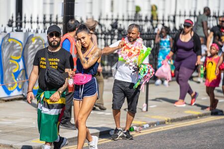 London, UK ,August 25, 2019.Caribbean colour comes to west London as Notting Hill Carnival gets into full swing with hundreds of thousands joining the throng on the capitals streetsのeditorial素材
