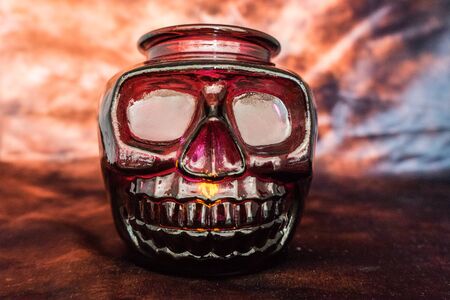 Halloween concept, spooky decorations with lighting up candle and candle holderの写真素材