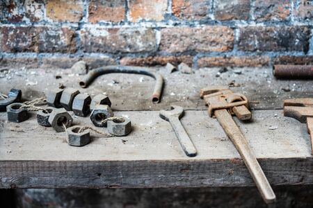 Mechanical workshop at old abandoned factory. Old rusty tools