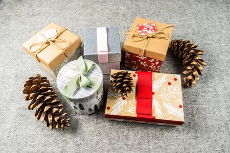 Christmas gift boxes on dark grey blanket background. Merry christmas greeting cards. Winter xmas...
