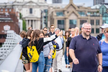 London, UK, July, 2019. Happy attractive girls taking selfie in London. Selected focus.のeditorial素材