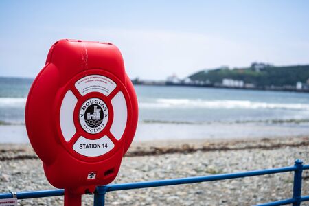 Douglas, Isle of Man, June 16, 2019.Douglas Bay. A lifebuoy, ring buoy, lifering, lifesaver, life donut, life preserver or lifebelt is a life saving buoyのeditorial素材