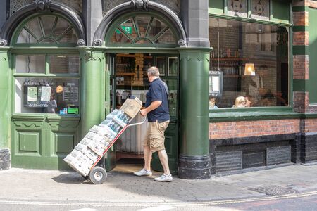 Cambridge, UK, August 1, 2019. Delivery man delivers drinks to the pub.のeditorial素材