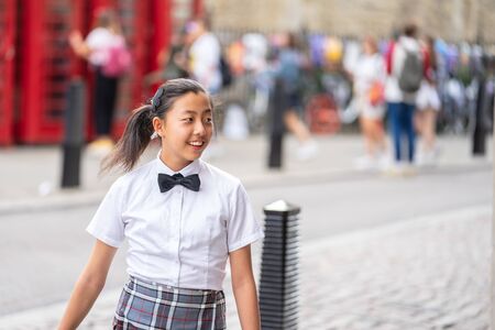 Cambridge, UK, August 1, 2019. High School Student Walking on Streetのeditorial素材