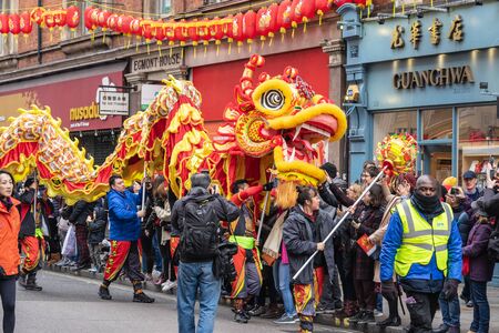 London, January 26, 2020. Members of parade in London Chinatown. Chinese New Year Celebrations. Selective focusのeditorial素材
