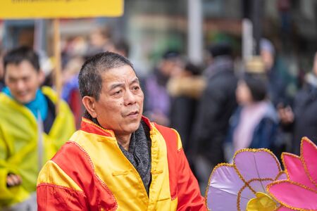 London, January 26, 2020. Members of parade in London Chinatown. Chinese New Year Celebrations. Selective focusのeditorial素材