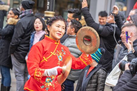 London, January 26, 2020. Members of parade in London Chinatown. Chinese New Year Celebrations. Selective focusのeditorial素材