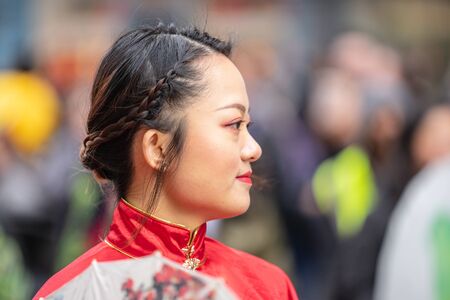 London, January 26, 2020. Portrait of beautiful young Chinese women wear in Traditional Chinese National Costume with umbrellaのeditorial素材