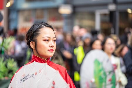 London, January 26, 2020. Portrait of beautiful young Chinese women wear in Traditional Chinese National Costume with umbrellaのeditorial素材